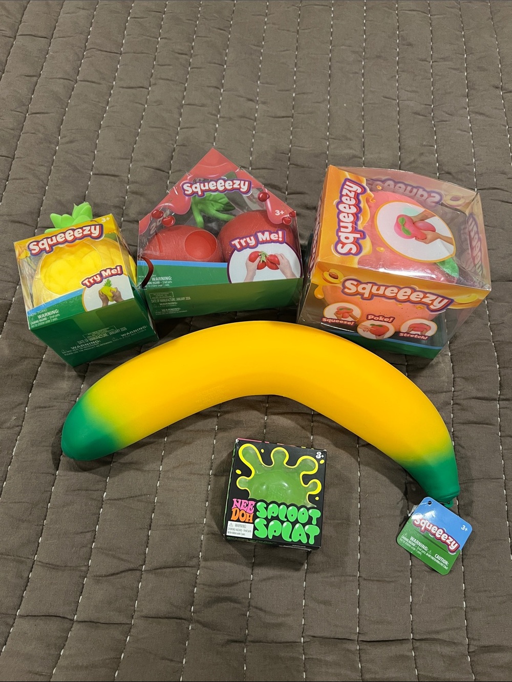 Needoh Sploot Splat, Squeezy Banana,Peach, Pineapple and Cherries.